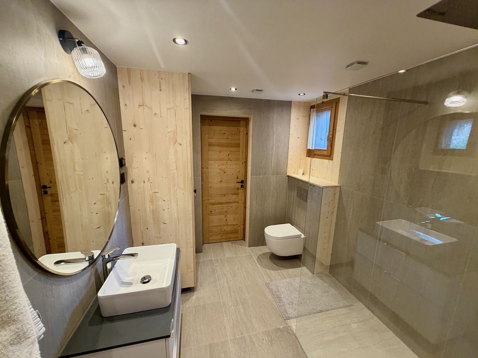 The family bathroom: wall-hung WC, wide basin and underfloor heating.