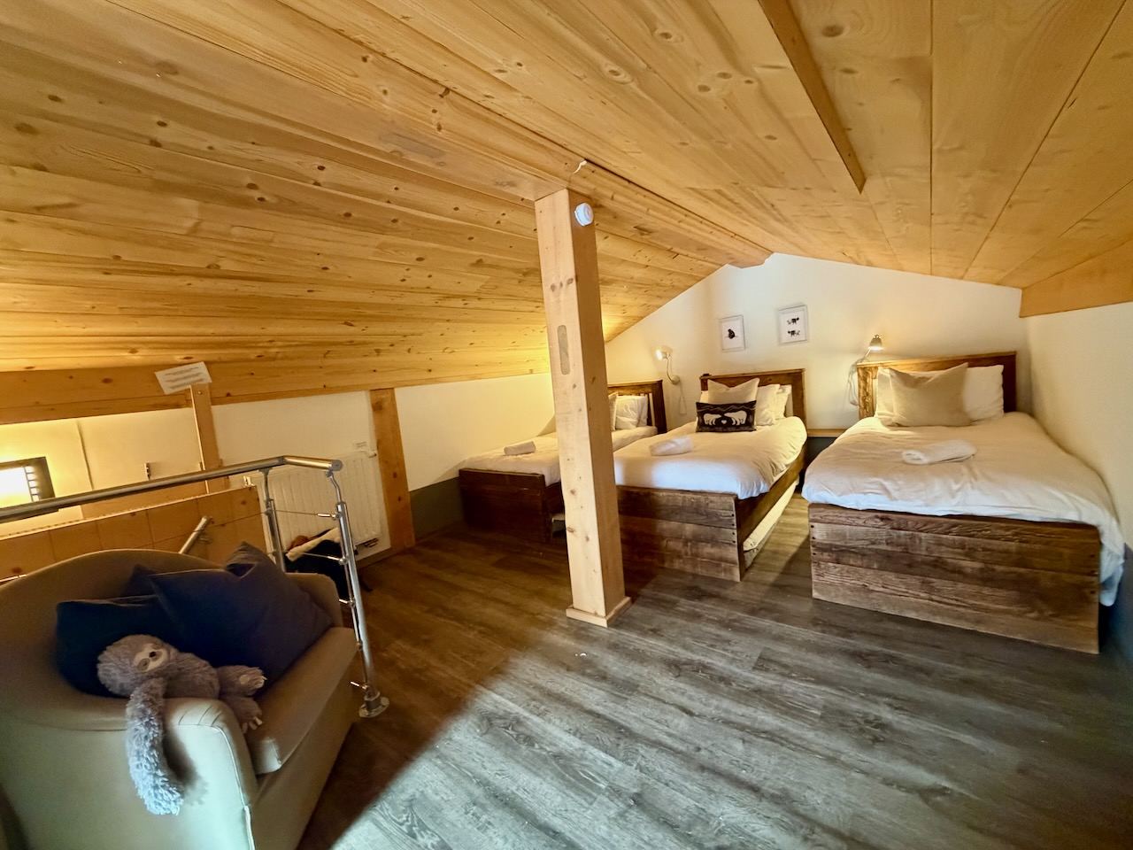 The attic bedroom: single beds under the eaves, up a steep staircase from the living room.