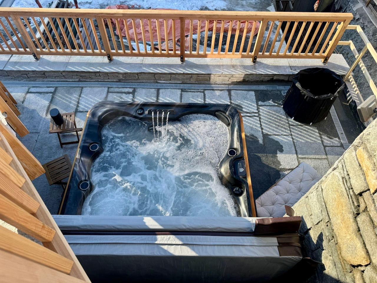 The hot tub, running — three sets of jets and LED lighting.