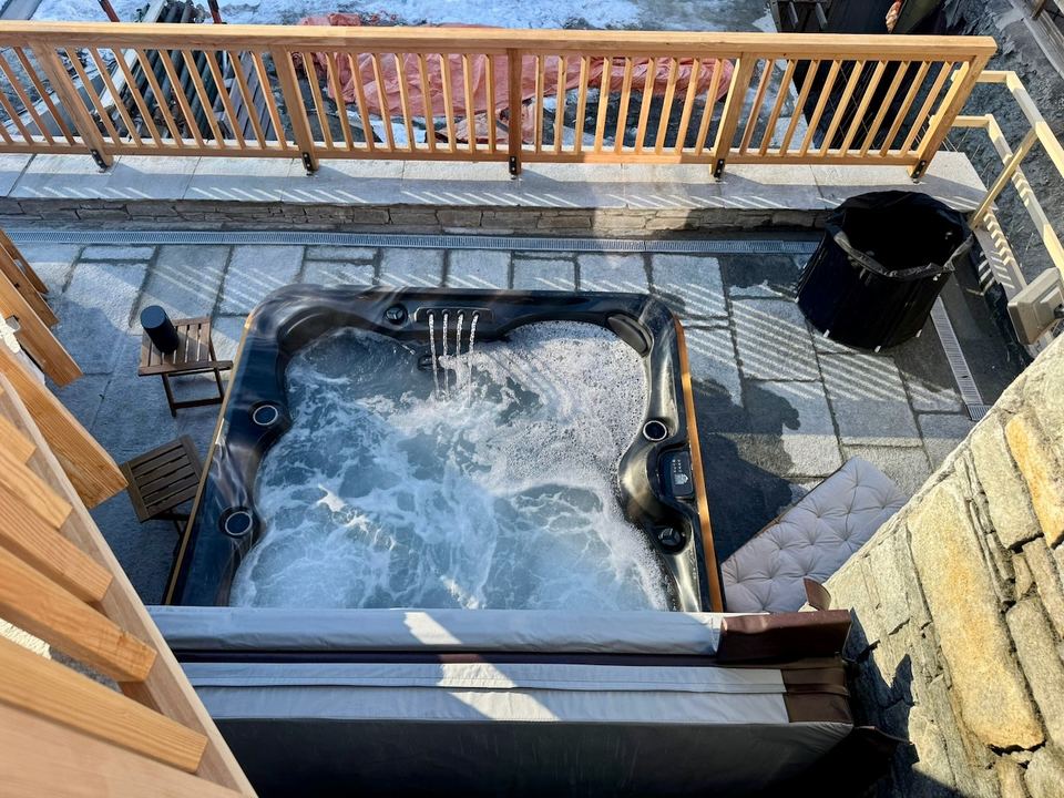 The hot tub, running — three sets of jets and LED lighting.