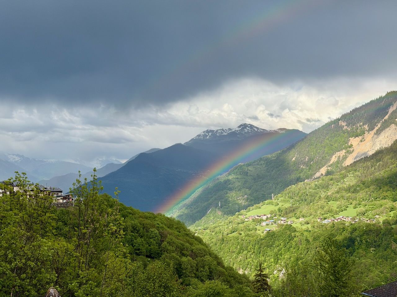 A rainbow over the valley in early summer.