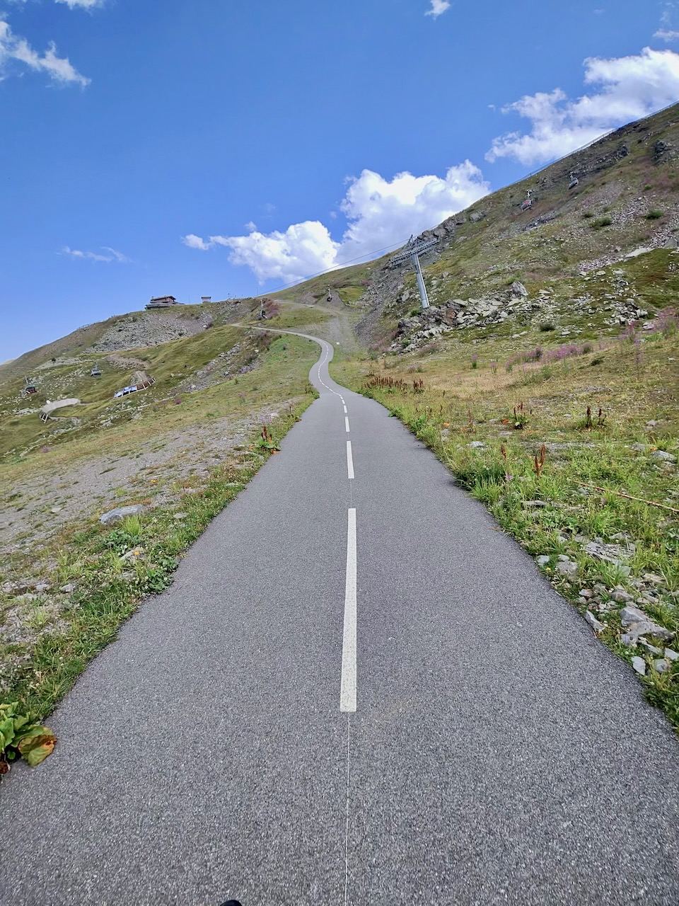 High mountain tarmac from the door — the climbs start where you are standing.