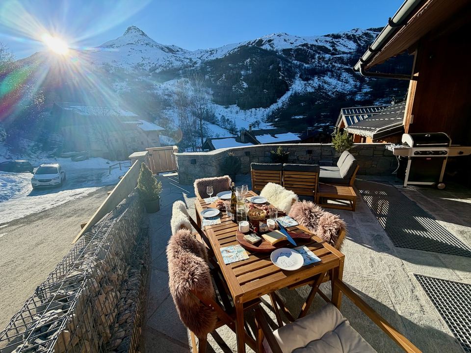 The upper terrace, laid for lunch, with the barbecue at the far end.