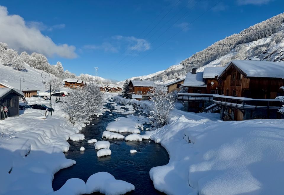The Doron running through the hamlet in winter.